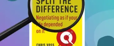 a magnifying glass overt the top of popular sales tactics book "Never Split the Difference" by chris voss